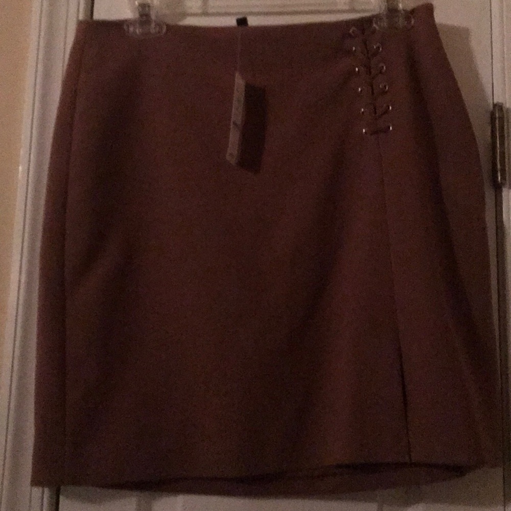 Brown short skirt with lacing in one side